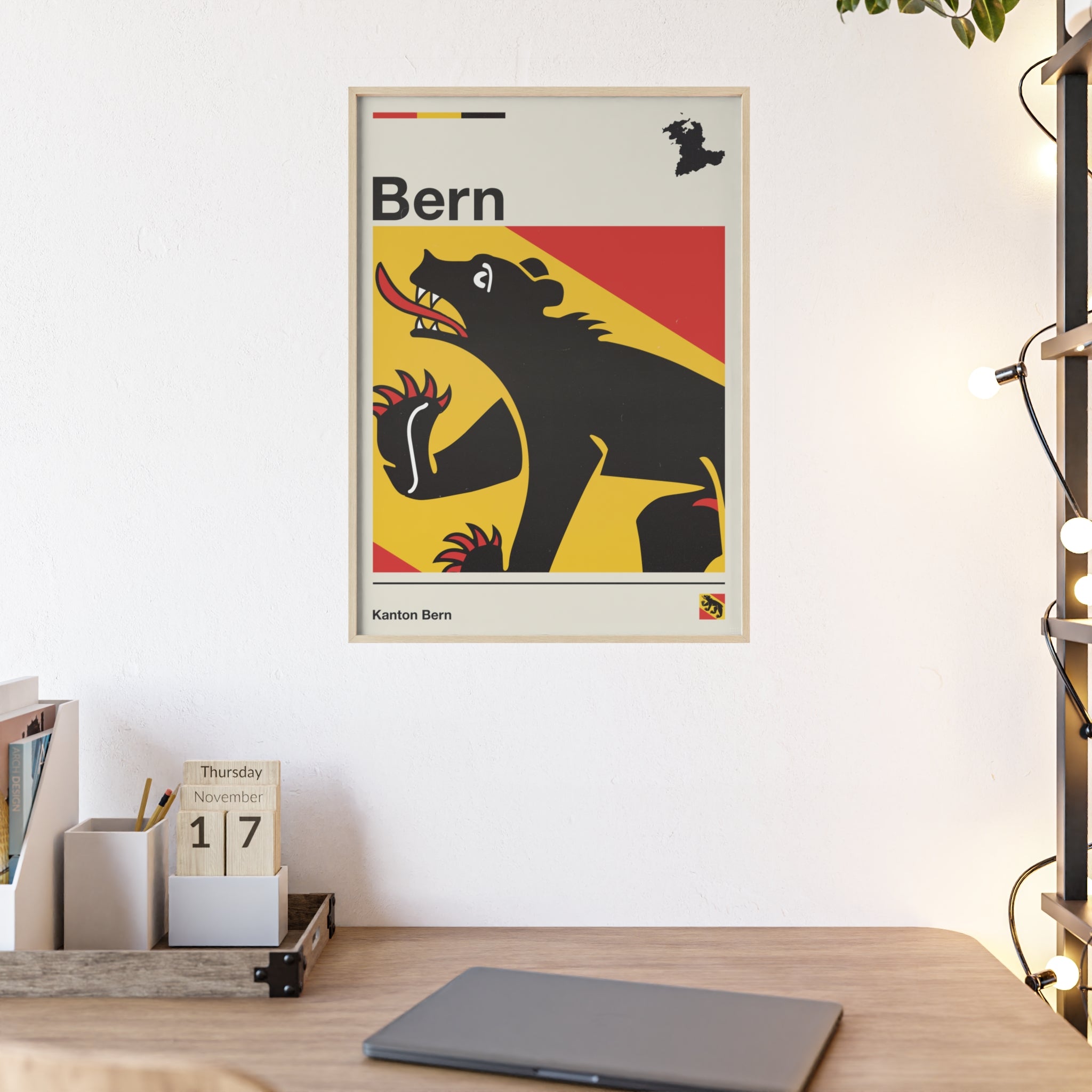 Minimalist framed Canton of Bern flag poster in modern Swiss graphic style, featuring the black bear heraldry on a red and yellow background with an off-white border. Large 50x70 cm vertical format in a natural wood frame.