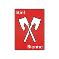 Minimalist framed wall poster of the Biel Bienne coat of arms featuring crossed white axes on a red background, displayed in a natural pinewood frame.