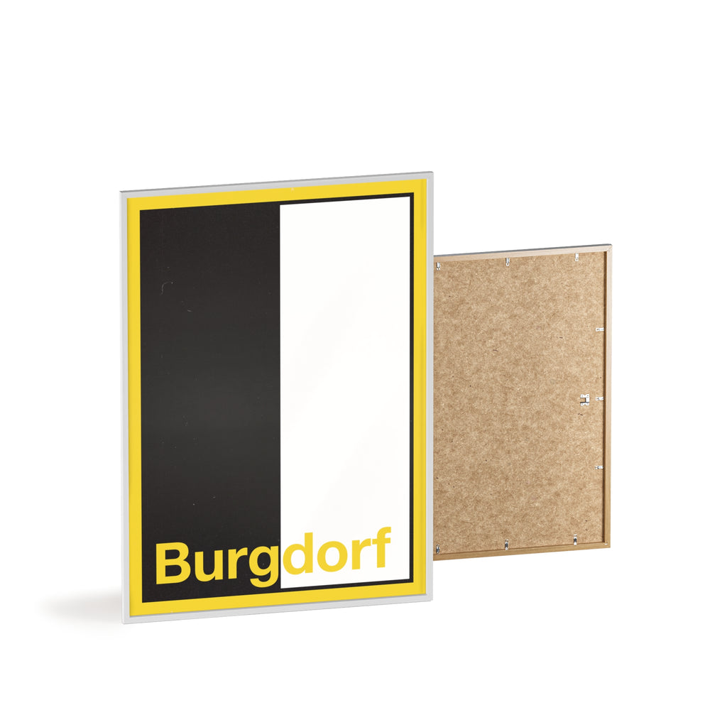 Minimalist framed wall poster of the Burgdorf coat of arms featuring vertical black and white panels with a yellow border, displayed in a natural pinewood frame.