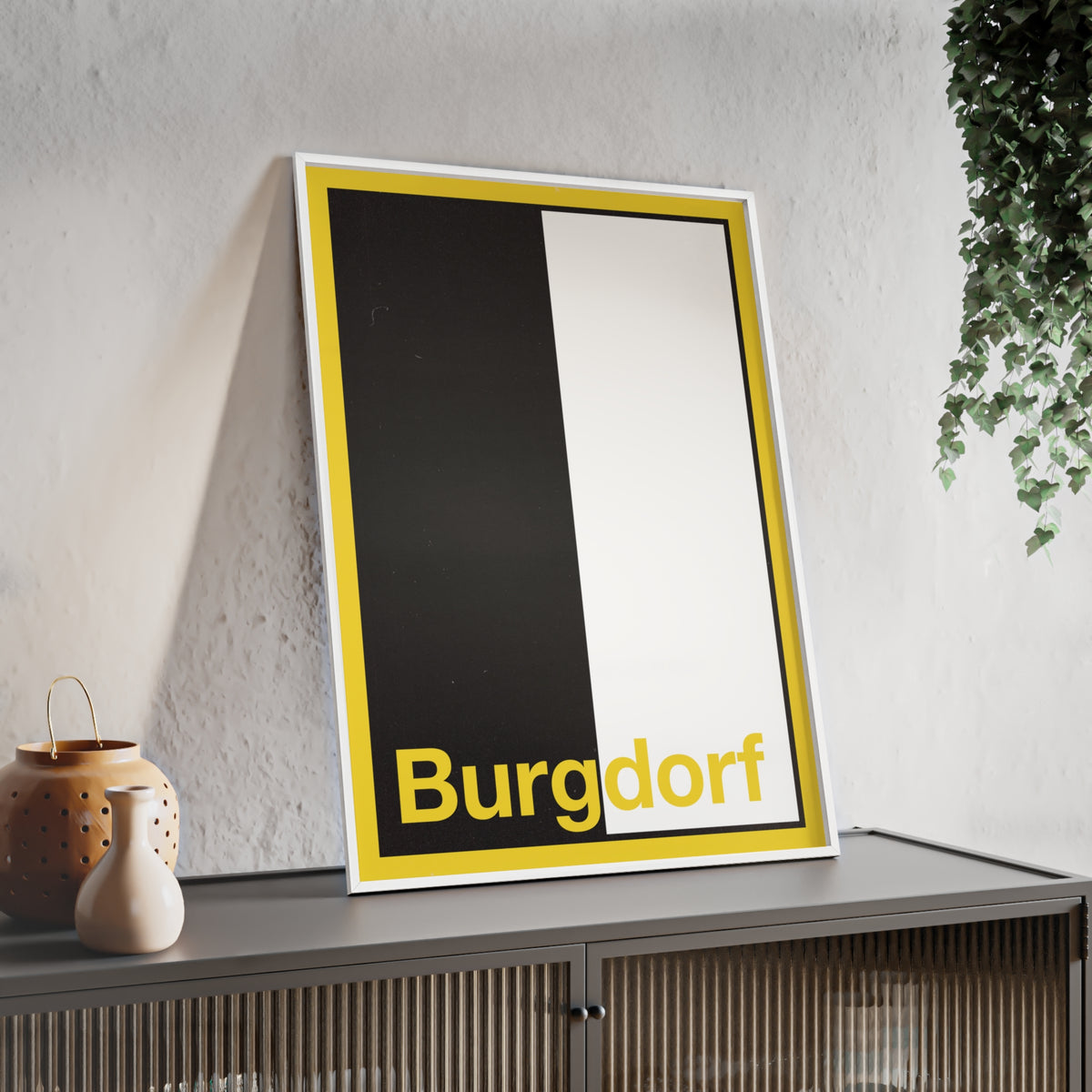 Minimalist framed wall poster of the Burgdorf coat of arms featuring vertical black and white panels with a yellow border, displayed in a natural pinewood frame.