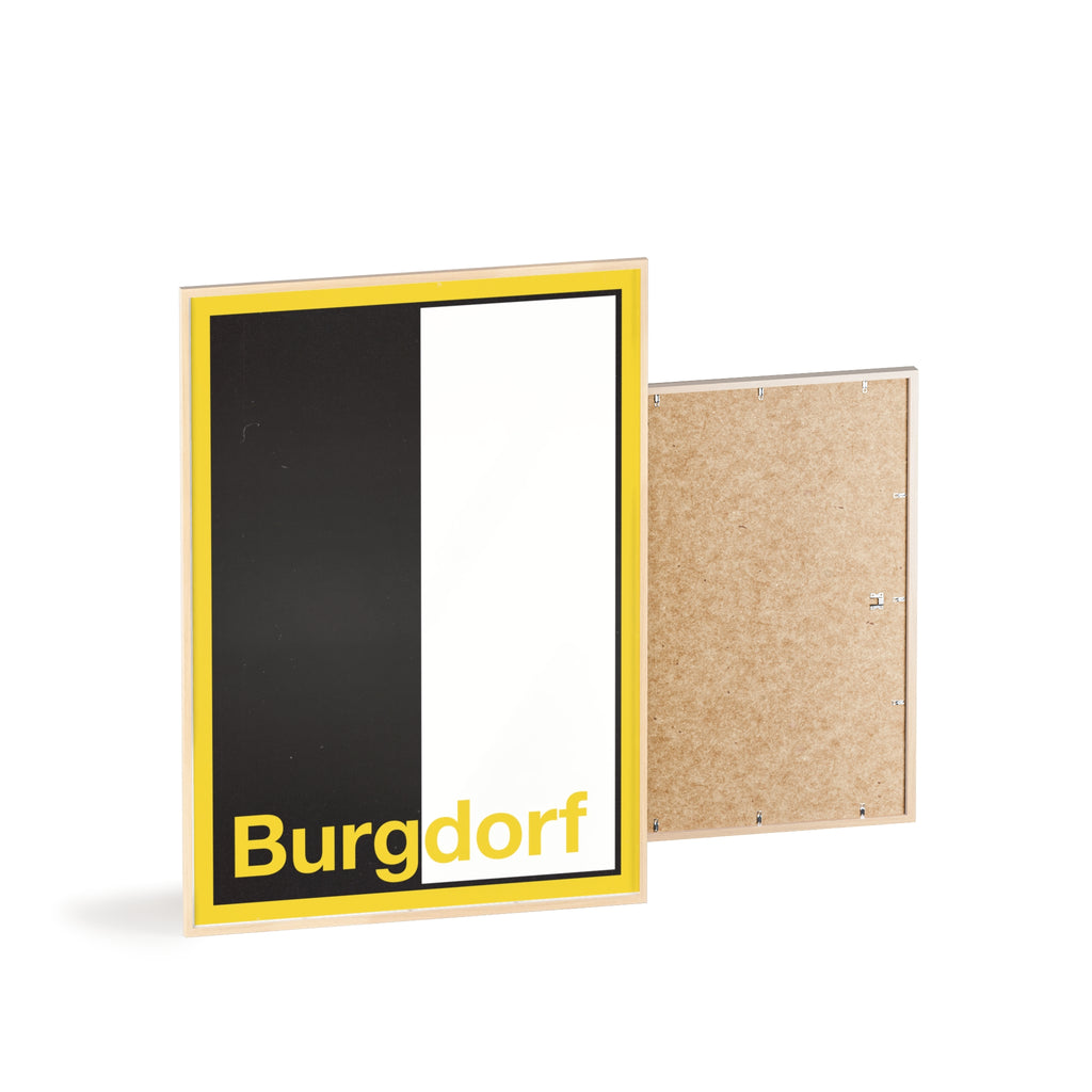 Minimalist framed wall poster of the Burgdorf coat of arms featuring vertical black and white panels with a yellow border, displayed in a natural pinewood frame.