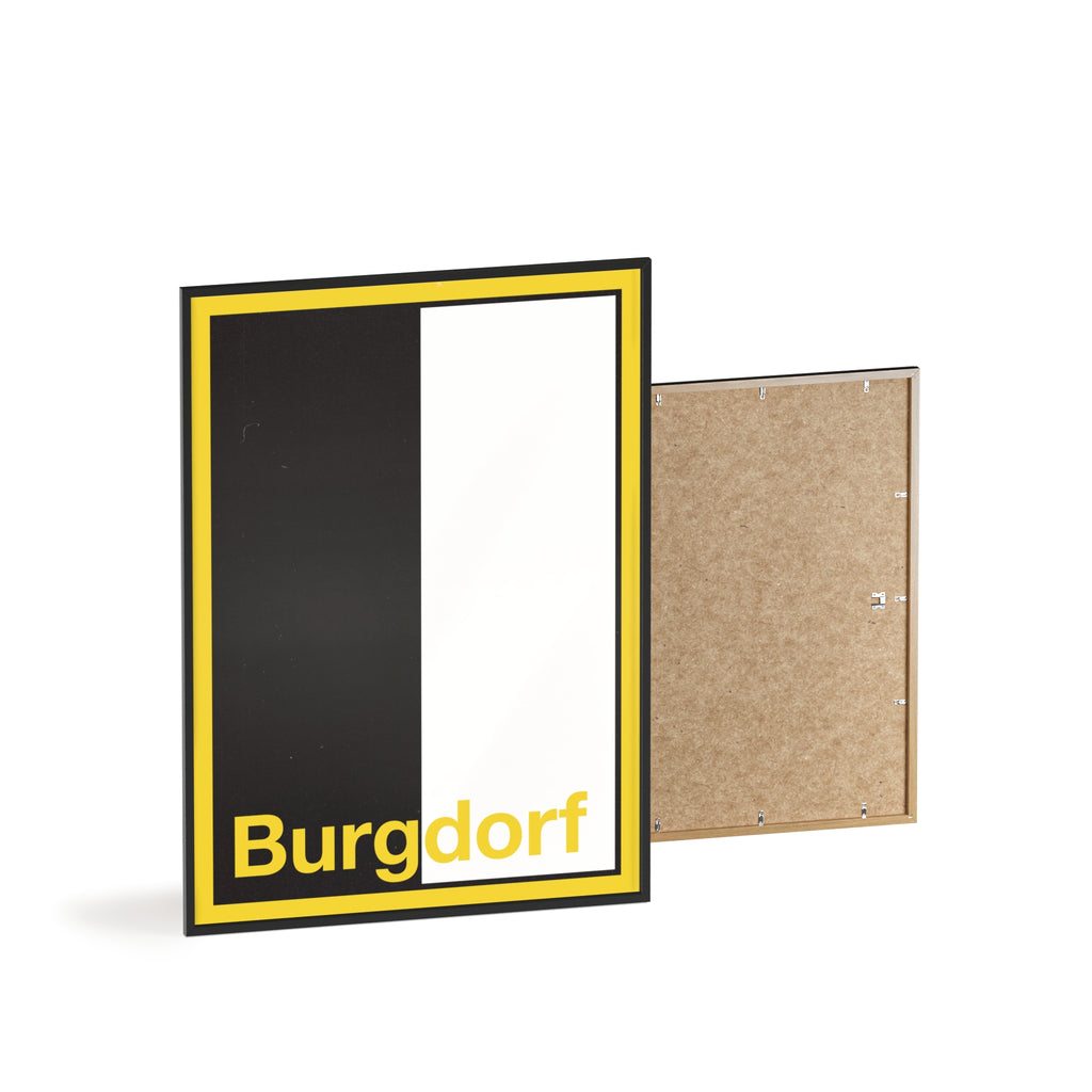 Minimalist framed wall poster of the Burgdorf coat of arms featuring vertical black and white panels with a yellow border, displayed in a natural pinewood frame.