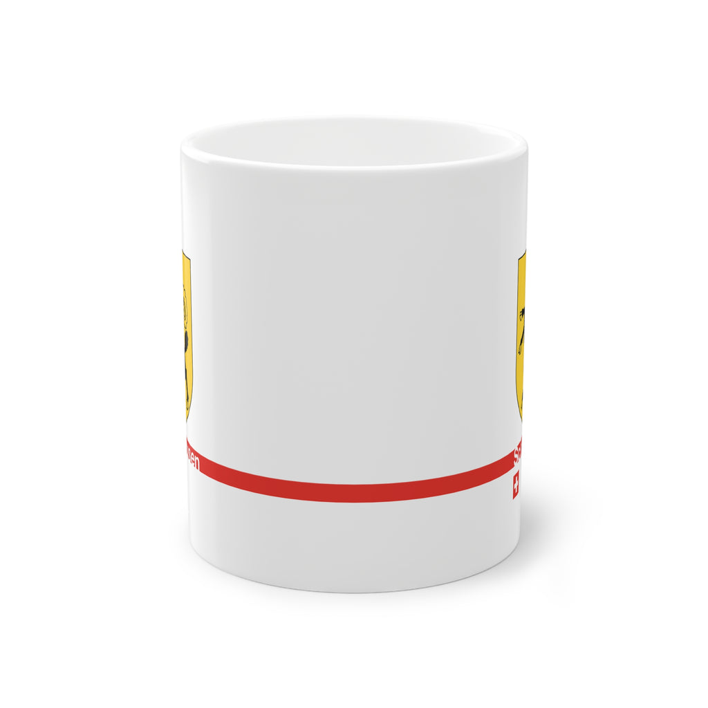 White ceramic mug featuring the golden Canton of Schaffhausen coat of arms with a black ram, a modern red horizontal line with 'Schaffhausen' text, and a small Swiss cross below.
