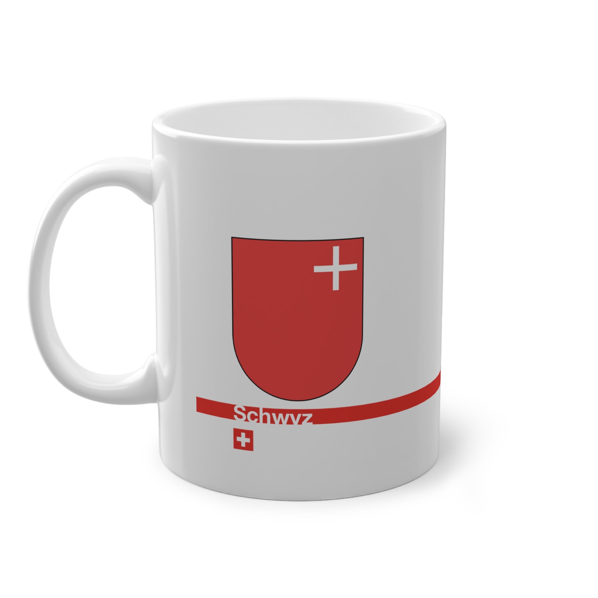 White ceramic mug featuring the red Canton of Schwyz coat of arms with a small white cross, a modern red horizontal line with 'Schwyz' text, and a small Swiss cross below.