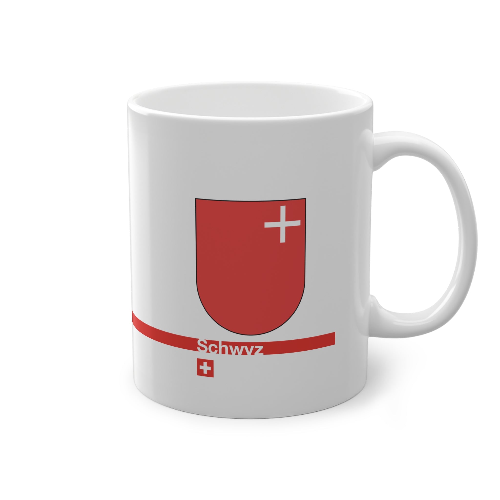 White ceramic mug featuring the red Canton of Schwyz coat of arms with a small white cross, a modern red horizontal line with 'Schwyz' text, and a small Swiss cross below.