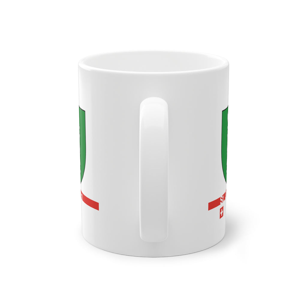 White ceramic mug featuring the green and silver Canton of St. Gallen coat of arms (fasces), a modern red horizontal line with 'St. Gallen' text, and a small Swiss cross below.