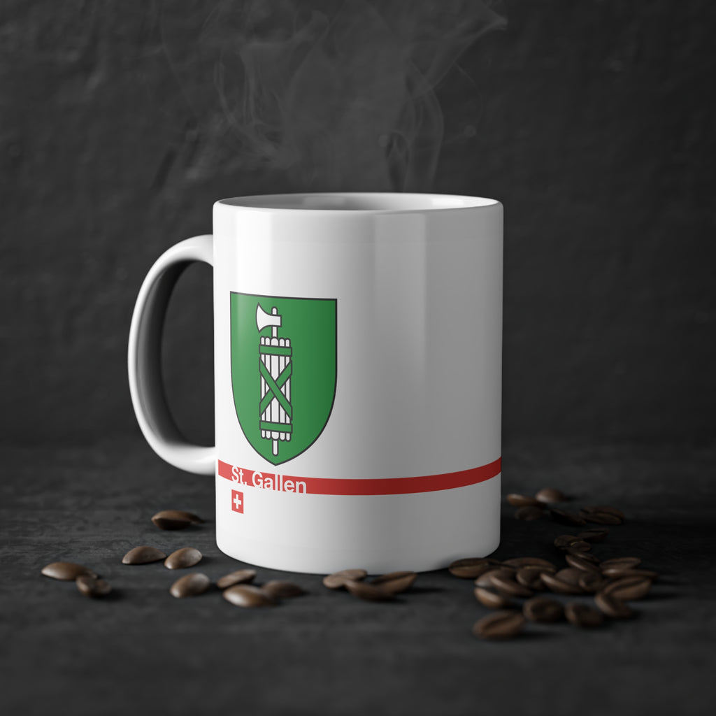 White ceramic mug featuring the green and silver Canton of St. Gallen coat of arms (fasces), a modern red horizontal line with 'St. Gallen' text, and a small Swiss cross below.