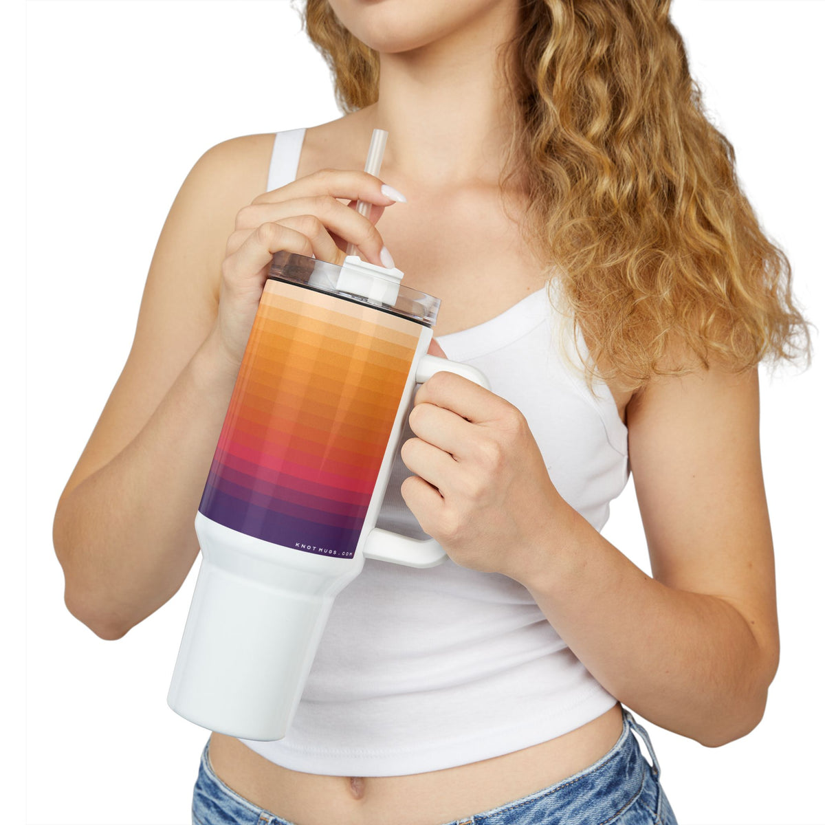 40oz stainless steel travel tumbler with white base, comfort handle, straw lid, and horizontal colorblock gradient stripes from violet to warm peach with a small Swiss cross detail.