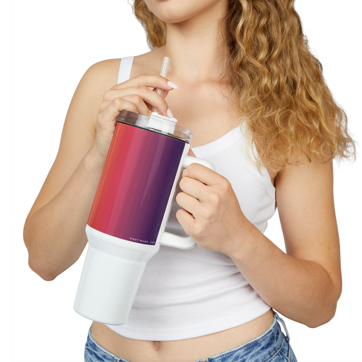 40oz stainless steel travel tumbler with handle and straw, featuring a glossy vertical sunset gradient from purple to orange with black stripes and a small Swiss cross detail.