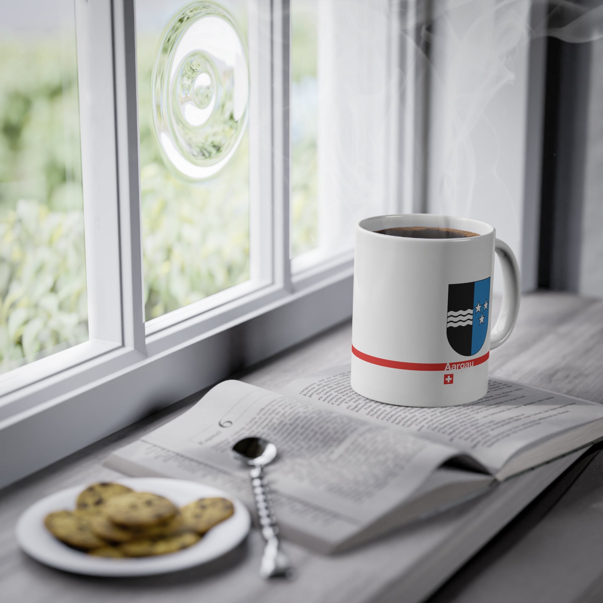 White ceramic mug with the vertically divided coat of arms of the Canton of Aargau (black with silver waves and blue with stars), featuring a modern red line and a small Swiss cross.