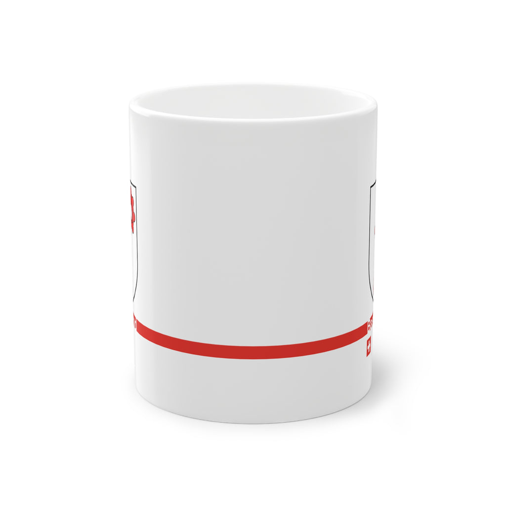 White ceramic mug featuring the red Basel-Landschaft coat of arms (red Baselstab), with a modern red horizontal line containing the text 'Basel-Land' and a small Swiss cross below.