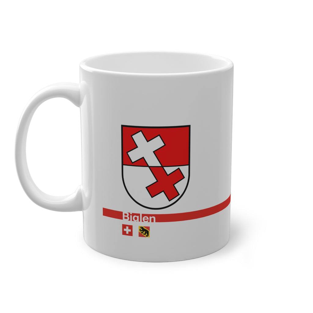 White ceramic mug featuring the red and white split coat of arms of the Biglen Commune, a modern red horizontal line with 'Biglen' text, and small Swiss and Bernese bear flags below.
