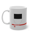 White ceramic mug with the black and white horizontally divided coat of arms of the Canton of Fribourg, Switzerland, featuring a modern red line and a small Swiss cross.