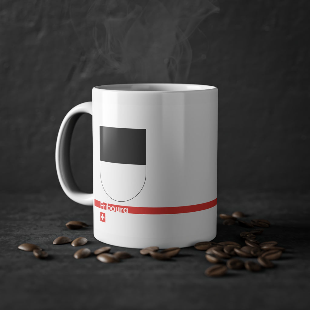 White ceramic mug with the black and white horizontally divided coat of arms of the Canton of Fribourg, Switzerland, featuring a modern red line and a small Swiss cross.