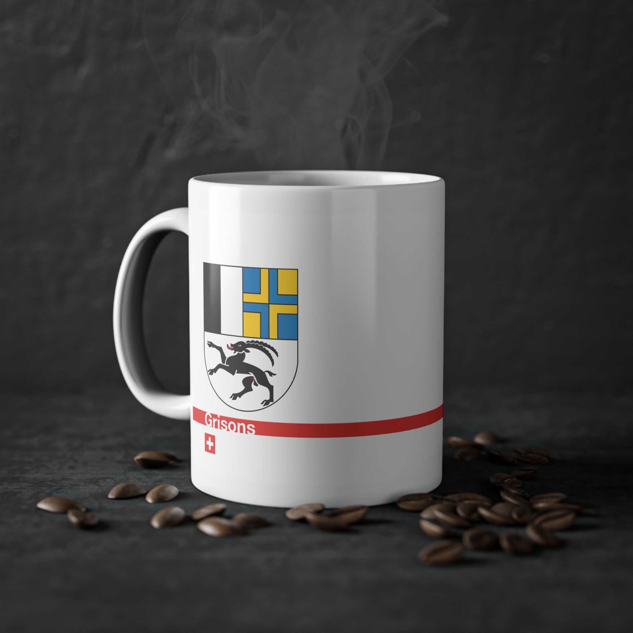 White ceramic mug with the Canton of Grisons (Graubünden) coat of arms featuring the black ibex, blue and yellow fields, a modern red line with 'Grisons' text, and a small Swiss cross.