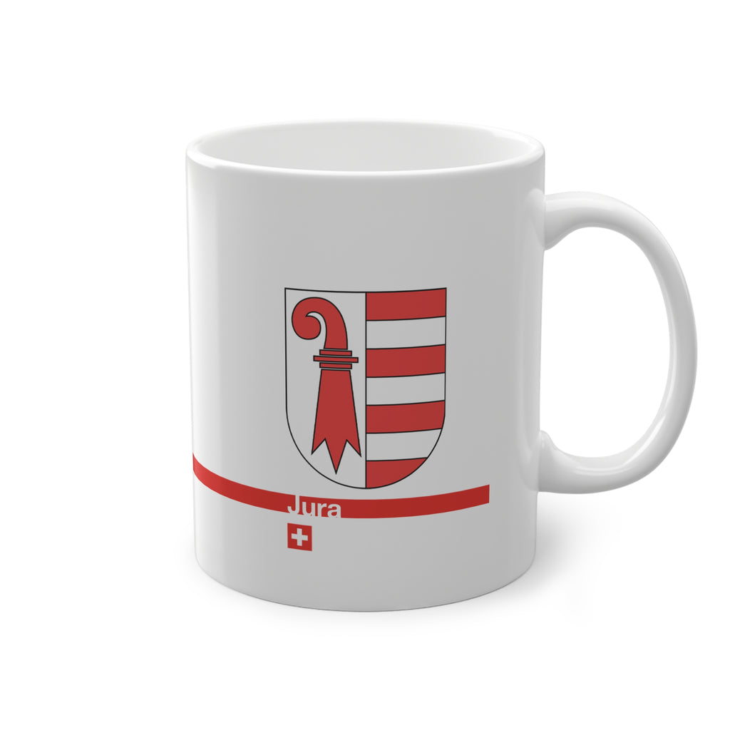 White ceramic mug featuring the red and white Canton of Jura coat of arms (bishop's crosier and seven stripes), a modern red horizontal line with 'Jura' text, and a small Swiss cross below.