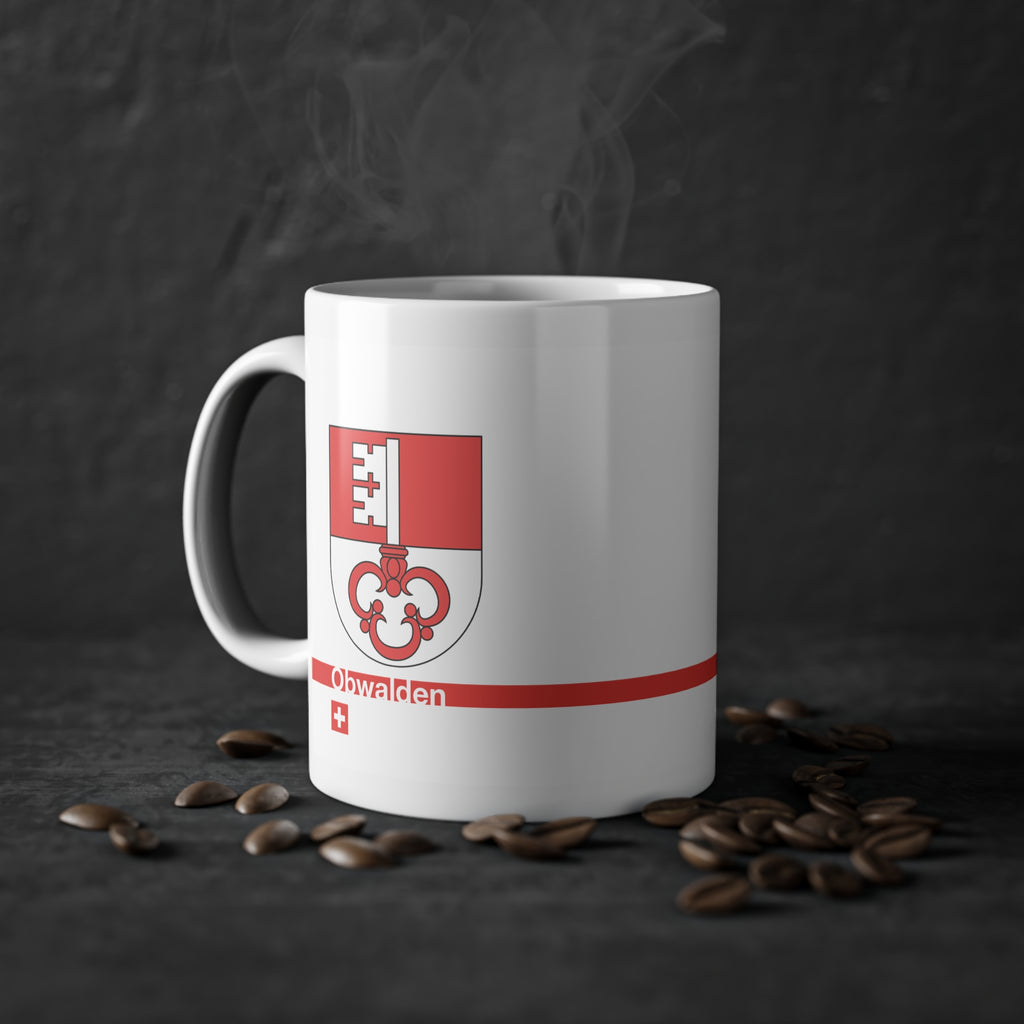 White ceramic mug featuring the red and white split Canton of Obwalden coat of arms (single white key), a modern red horizontal line with 'Obwalden' text, and a small Swiss cross below.