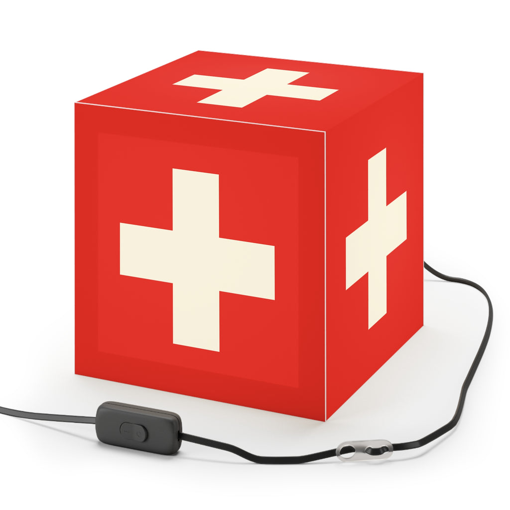Minimalist cube-shaped lamp featuring the red and white Swiss cross flag design. Available in regular 30 cm and small 20 cm sizes, shown as a geometric lighting fixture with a matte finish, perfect for modern home decor and Swiss National Day 1st of August celebrations.