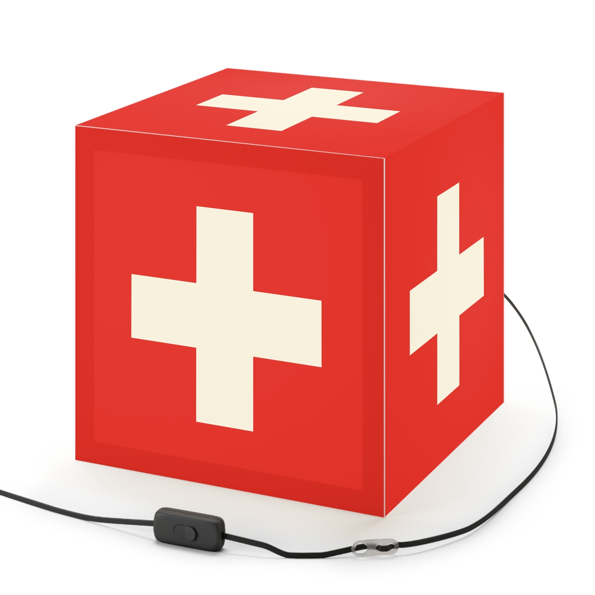 Minimalist cube-shaped lamp featuring the red and white Swiss cross flag design. Available in regular 30 cm and small 20 cm sizes, shown as a geometric lighting fixture with a matte finish, perfect for modern home decor and Swiss National Day 1st of August celebrations.