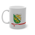 White ceramic mug featuring the green and white Canton of Thurgau coat of arms with two golden lions, a modern red horizontal line with 'Thurgau' text, and a small Swiss cross below.