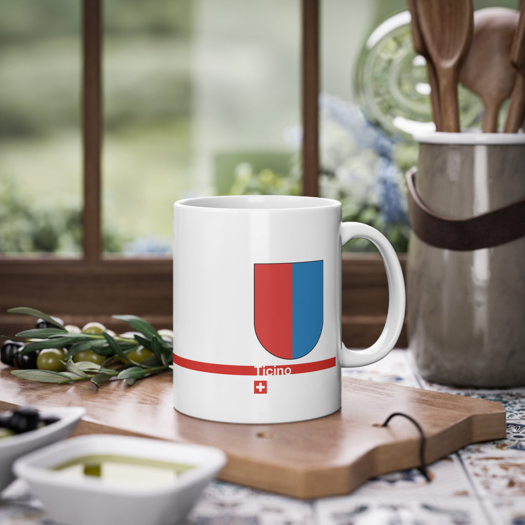White ceramic mug with the red and blue vertically divided coat of arms of the Canton of Ticino, Switzerland, featuring a modern red line and a small Swiss cross.
