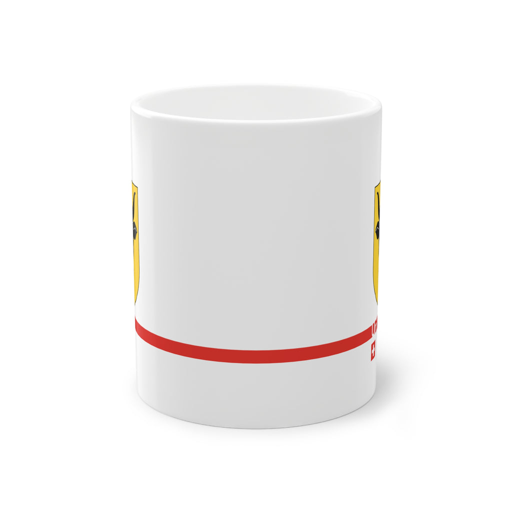 White ceramic mug featuring the golden Canton of Uri coat of arms with a black bull's head and red nose ring, a modern red horizontal line with 'Uri' text, and a small Swiss cross below.