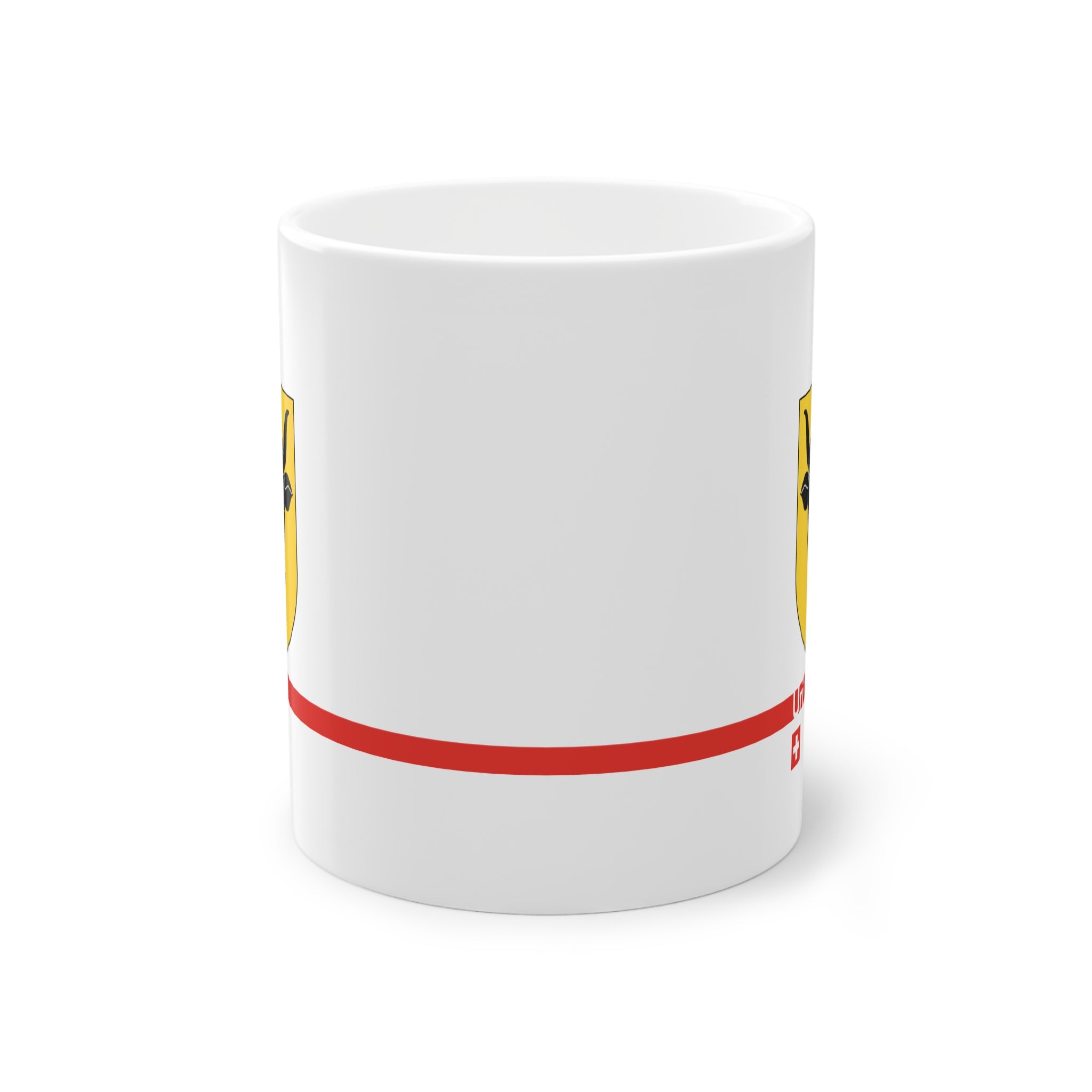 White ceramic mug featuring the golden Canton of Uri coat of arms with a black bull's head and red nose ring, a modern red horizontal line with 'Uri' text, and a small Swiss cross below.