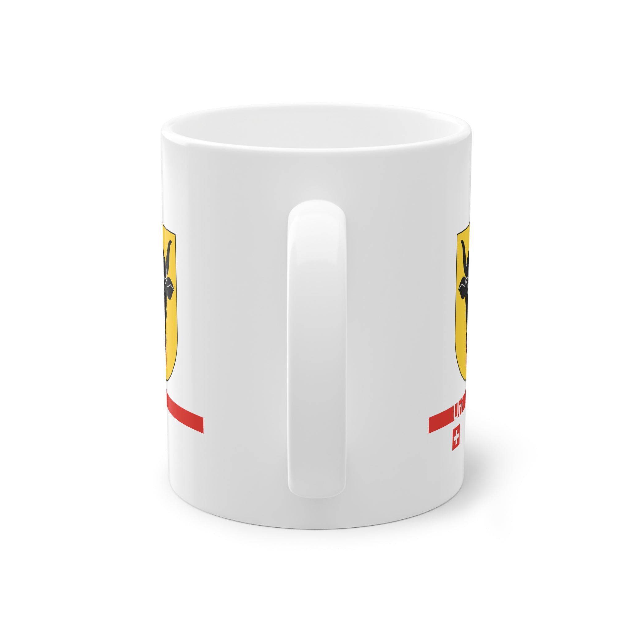 White ceramic mug featuring the golden Canton of Uri coat of arms with a black bull's head and red nose ring, a modern red horizontal line with 'Uri' text, and a small Swiss cross below.