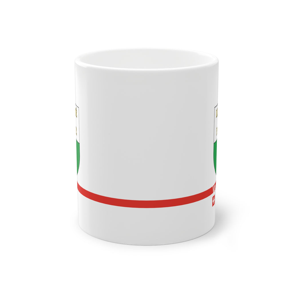 White ceramic mug featuring the white and green Canton of Vaud coat of arms with golden 'Liberté et Patrie' text, a modern red horizontal line with 'Vaud' text, and a small Swiss cross below.