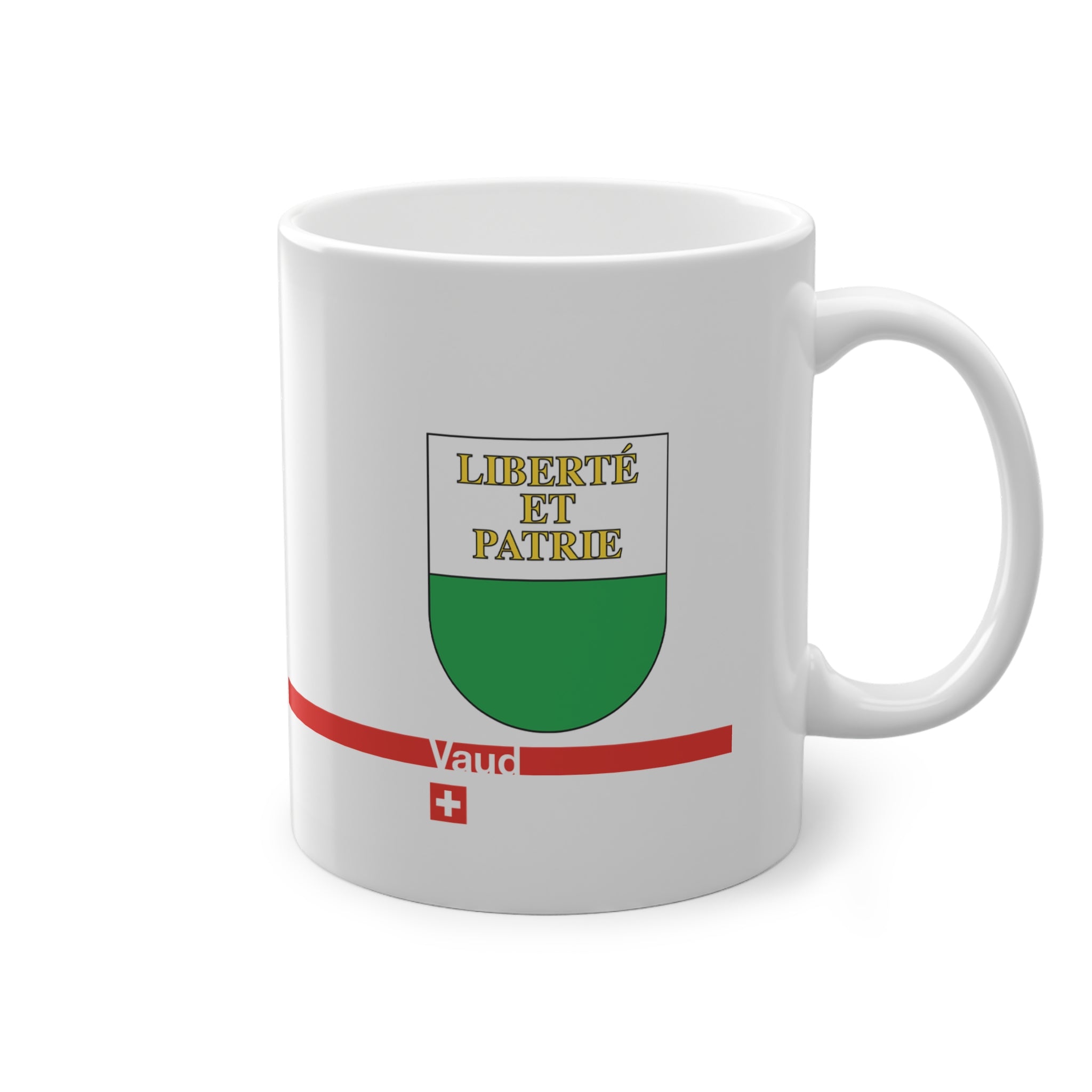 White ceramic mug featuring the white and green Canton of Vaud coat of arms with golden 'Liberté et Patrie' text, a modern red horizontal line with 'Vaud' text, and a small Swiss cross below.