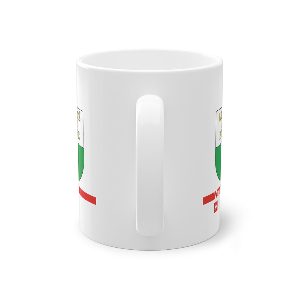 White ceramic mug featuring the white and green Canton of Vaud coat of arms with golden 'Liberté et Patrie' text, a modern red horizontal line with 'Vaud' text, and a small Swiss cross below.