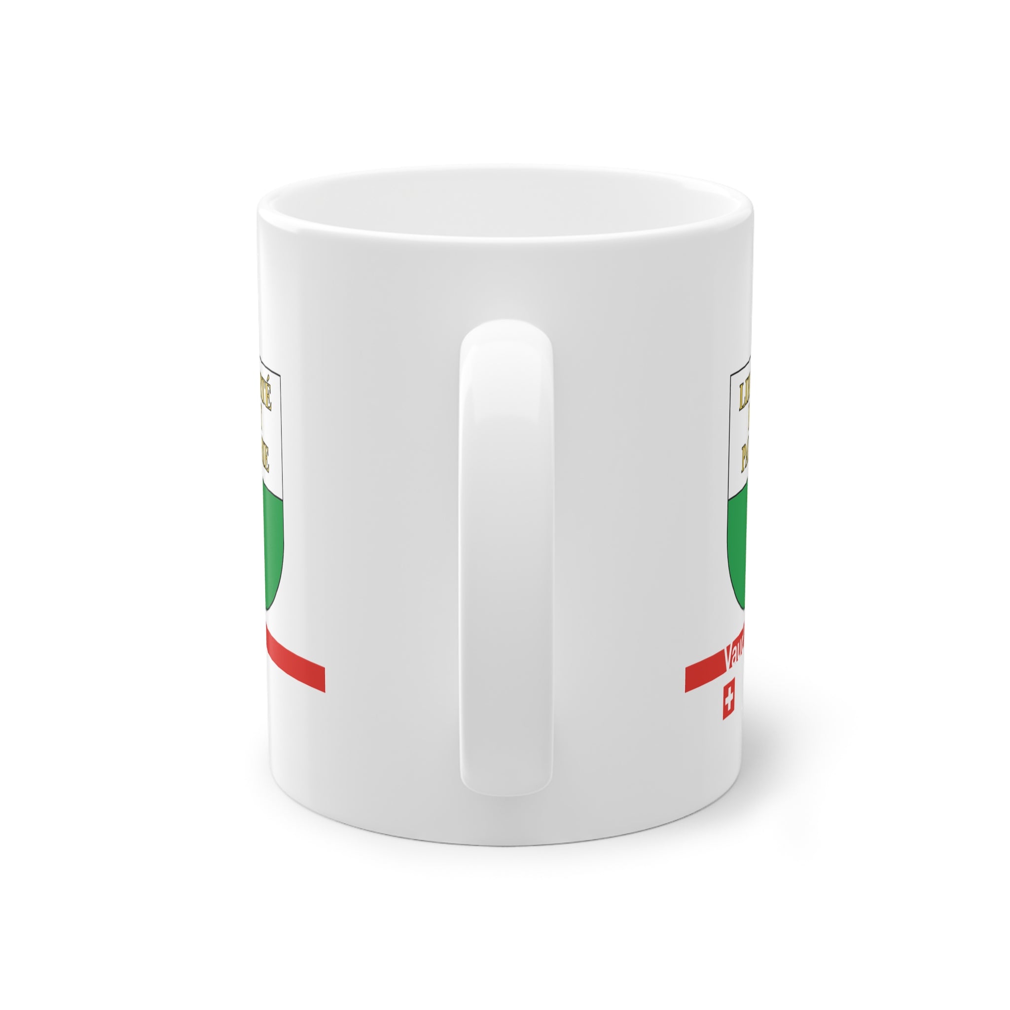 White ceramic mug featuring the white and green Canton of Vaud coat of arms with golden 'Liberté et Patrie' text, a modern red horizontal line with 'Vaud' text, and a small Swiss cross below.