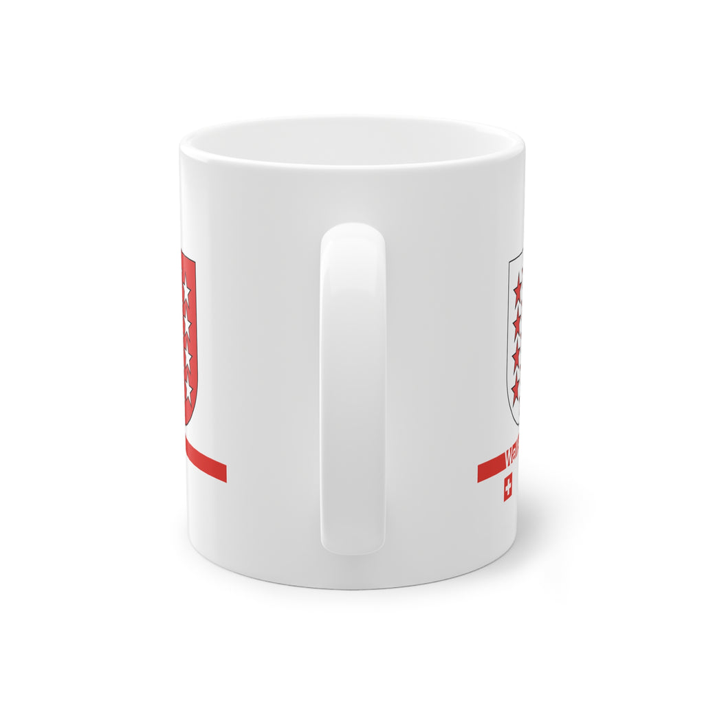 White ceramic mug featuring the red and white Canton of Wallis (Valais) coat of arms with 13 stars, a modern red horizontal line with 'Wallis' text, and a small Swiss cross below.