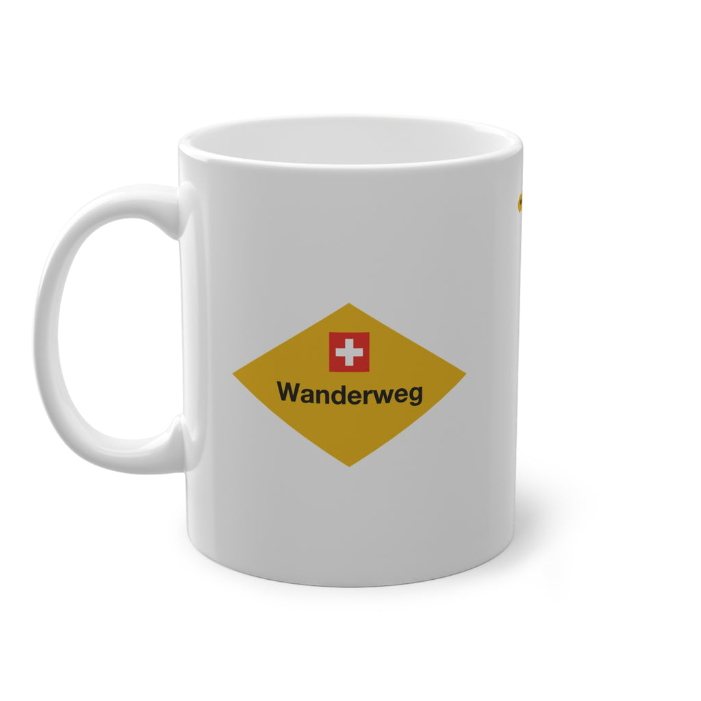 Yellow Swiss hiking trail sign coffee mug on a wooden table