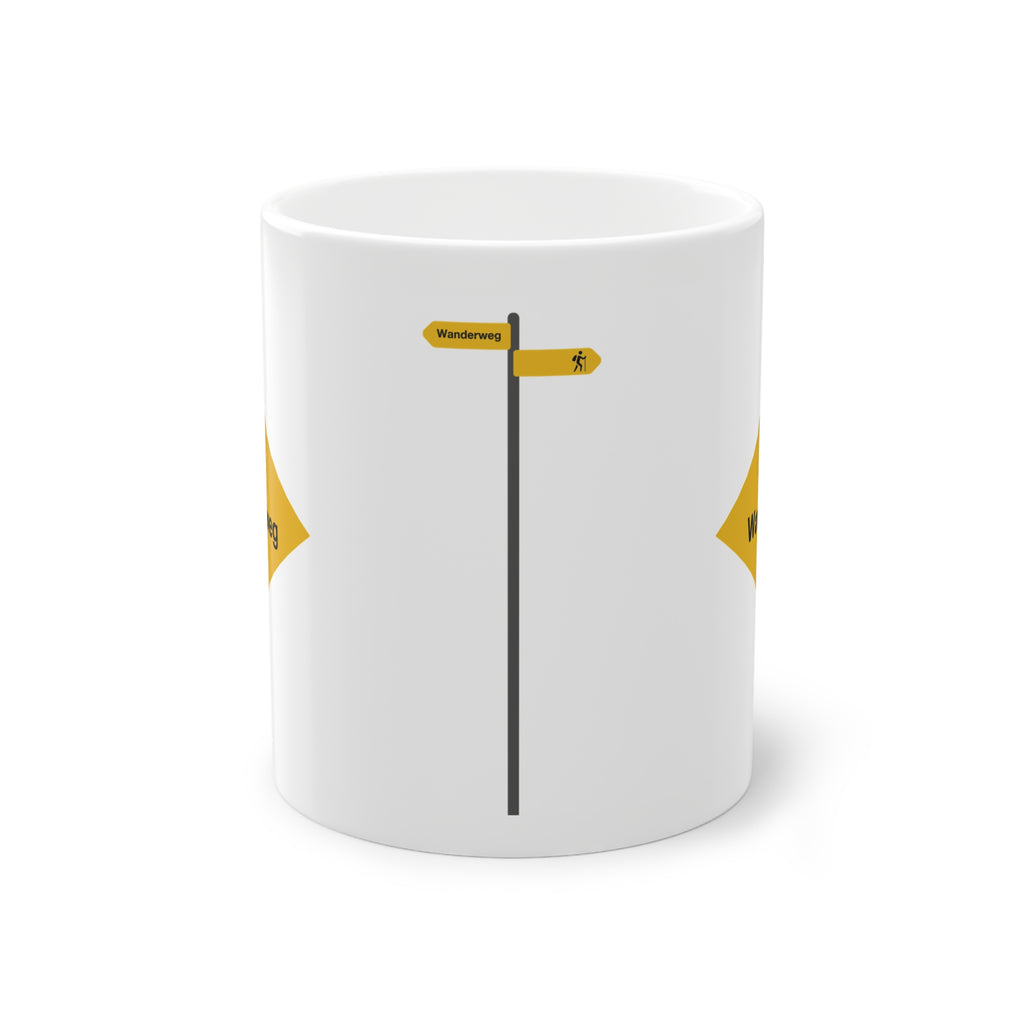 Yellow Swiss hiking trail sign coffee mug on a wooden table