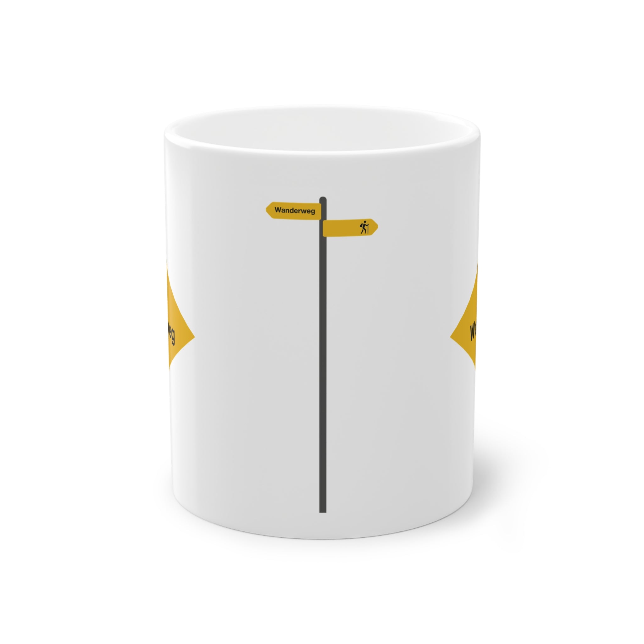 Yellow Swiss hiking trail sign coffee mug on a wooden table