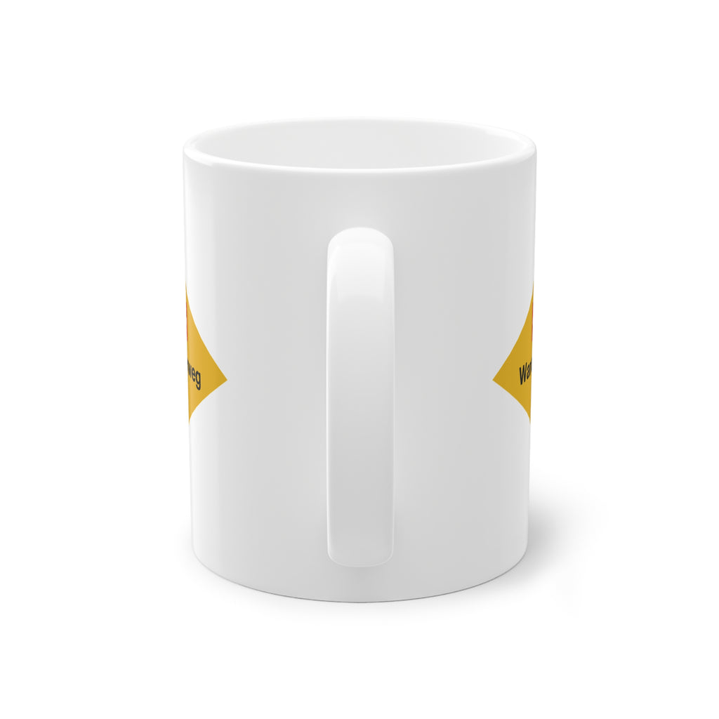 Yellow Swiss hiking trail sign coffee mug on a wooden table