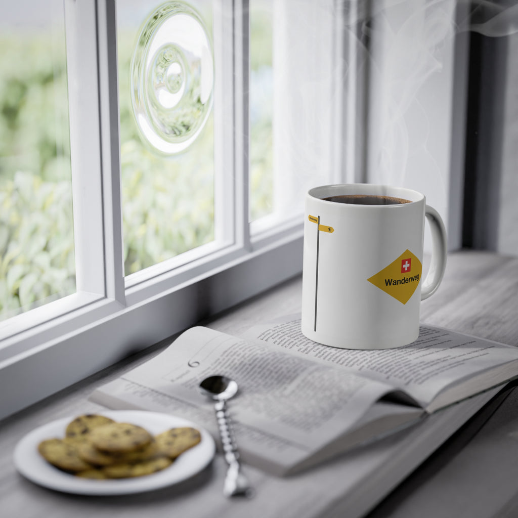 Yellow Swiss hiking trail sign coffee mug on a wooden table
