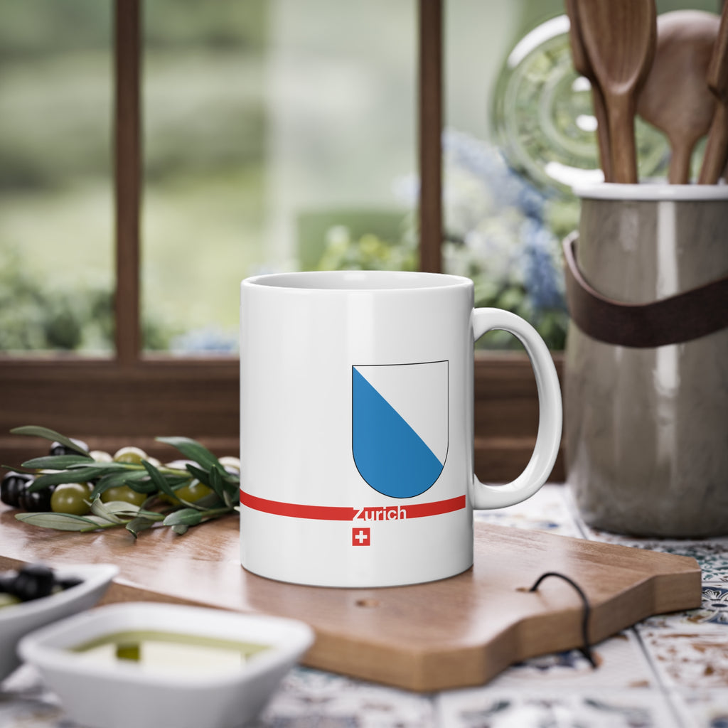 White ceramic coffee mug with the blue and white diagonally divided coat of arms of the Canton of Zurich, Switzerland.